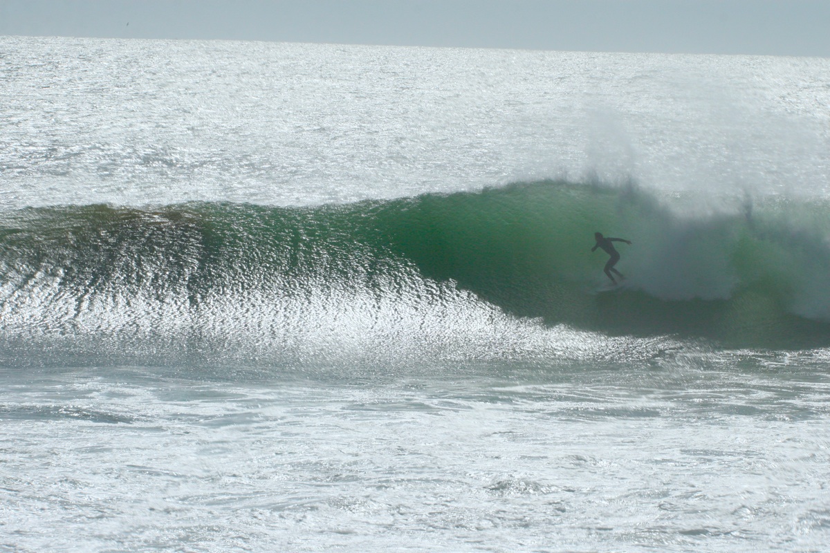 Taghazout surf camp Morocco â€” Anchor Point waves with surfers on the Atlantic coast near Agadir